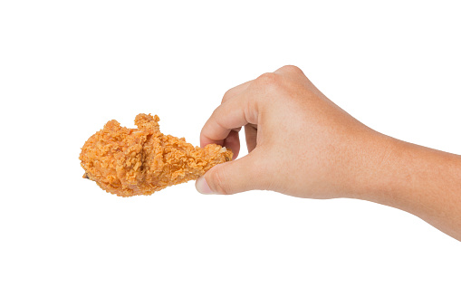 Hand hold fried calf chicken isolated on white background