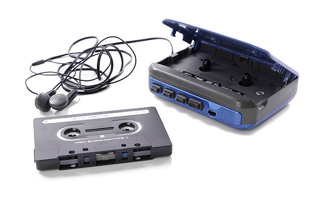 music cassette and walkman old-fashioned music cassette and walkman with earphones                                personal stereo stock pictures, royalty-free photos & images