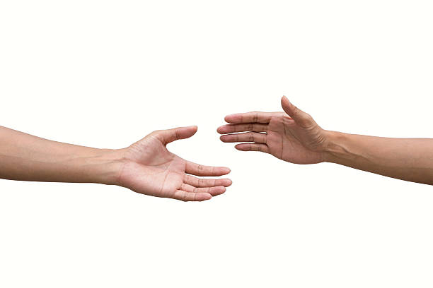istock couple of helping/praying hand black background 517310364