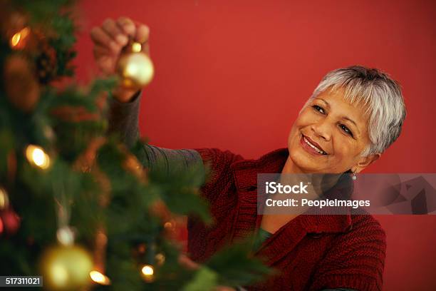 The Final Touch On The Tree Stock Photo - Download Image Now - 60-69 Years, Abstract, Active Seniors