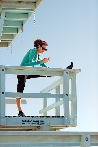 Woman exercising in LA, Venice Beach, California
