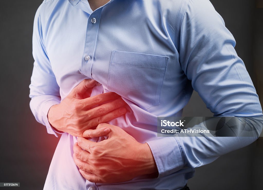Businessman in blur shirt stomachache Illness Stock Photo