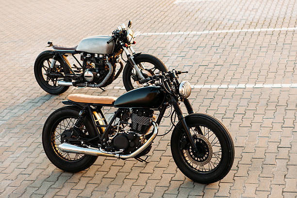 istock Two black and silver vintage custom motorcycles caferacers 517313300