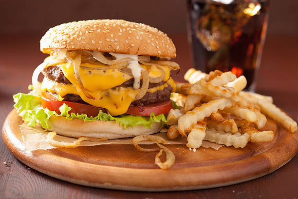 istock double cheeseburger with tomato and onion 517313308