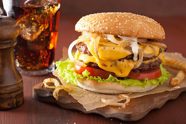 istock double cheeseburger with tomato and onion 517313434