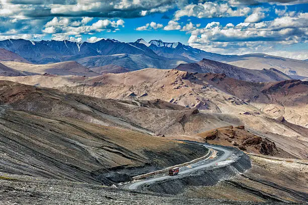 Indian lorry truck on road in Himalayas near Tanglang la Pass  - Himalayan mountain pass on the Leh-Manali highway. Ladakh, India