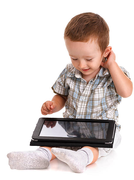 istock Baby toddler looking bemused at a digital tablet 517320945