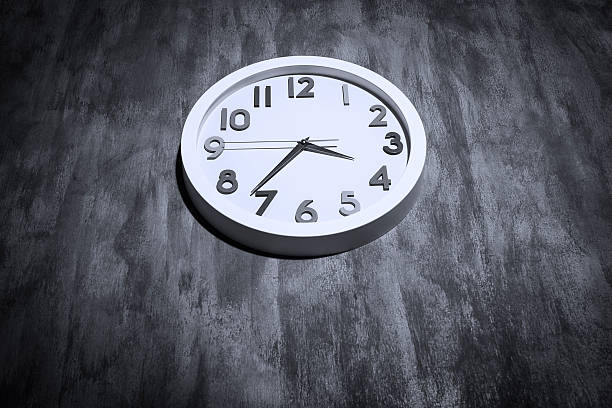 istock Modern clock on a grungy concrete wall 517321145