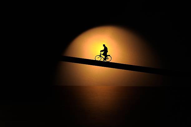 Silhouette of the cyclist.  Silhouette bike cyclist miniature.