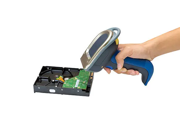 Holding and Scanning on the harddisk with wireless barcode scanner isolated over white background