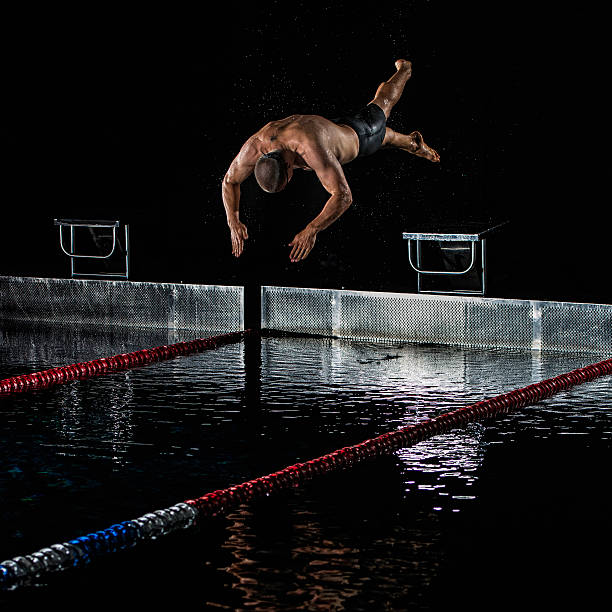 istock Male Swimmer In Mid-Air 517326423