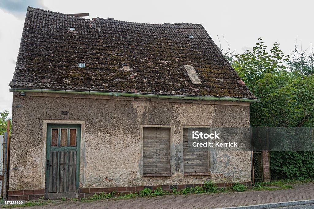 Old abandond house - damaged old small house in a village in Germany. its damaged and abandoned. danger to entry. House Stock Photo
