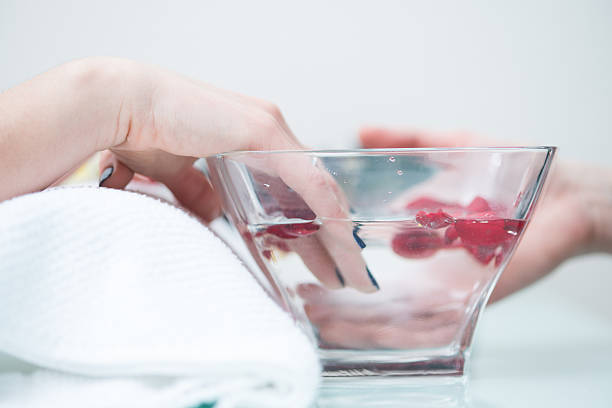 Close-up of Varnishing Nails at Beauty Salon, Europe stock photo