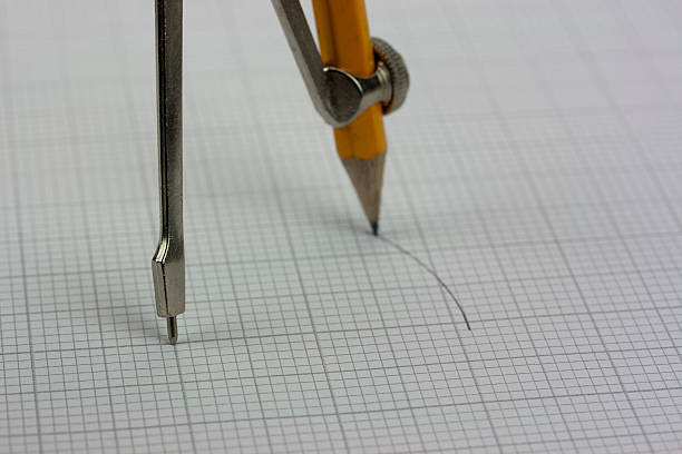 istock Close up of a compass on graph paper 517337192