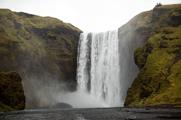 istock Waterfall in Iceland and green hills 517340962
