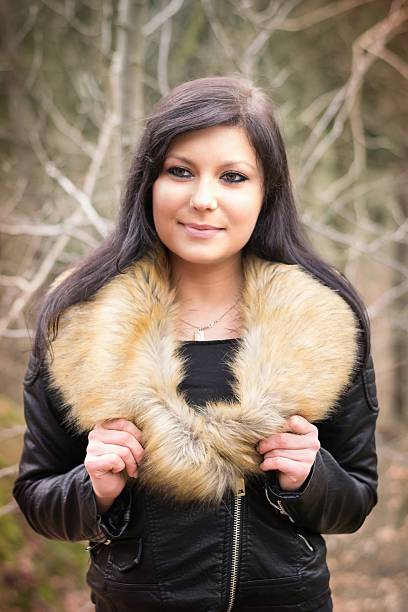 istock young woman with fur jacket 517340988
