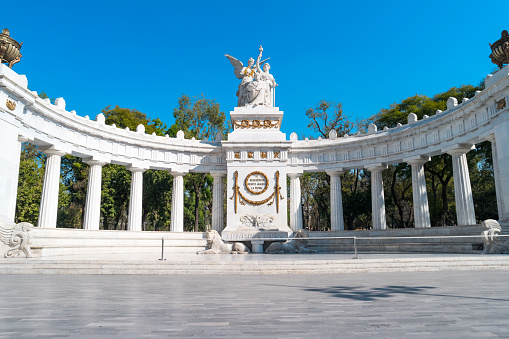 Photo of the Benito Juarez Hemicycle at the Alameda Central park in downtown Mexico City, Mexico. It was built between 1906-1911 in Neoclassical style an it is commemorating the Mexican president Benito Juarez who lived between 1806-1872. The pedestal bears the inscription \