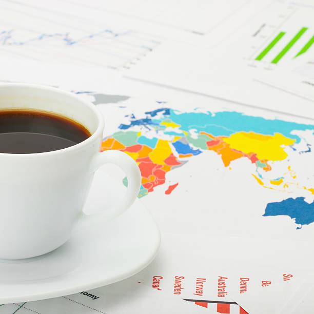 istock Coffee cup over financial documents - 1 to 1 ratio 517341395