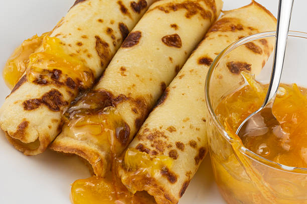 istock pancakes on a plate with orange marmalade 517341449