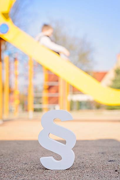 White paragraph symbol on children playground White paragraph symbol on children playground. Family law or playground accident concept. schoolyard fight stock pictures, royalty-free photos & images