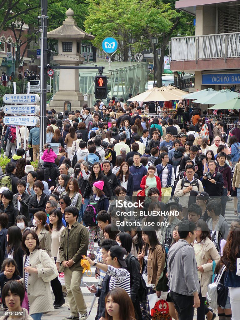 Omotesando is very popular shopping street with crowd Tokyo, Japan - April 19, 2014: Omotesando is very popular shopping street with crowd Adulation Stock Photo