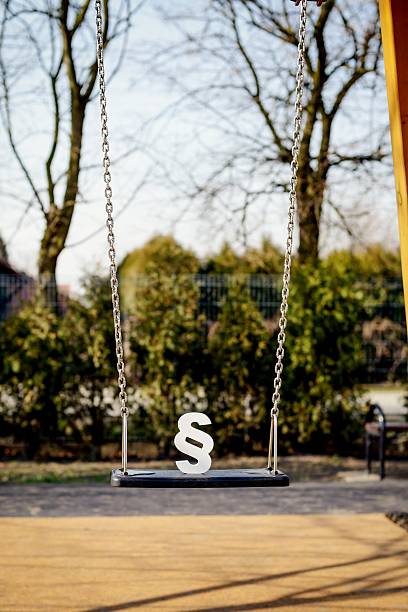 istock White paragraph symbol on children chain swing. 517342674