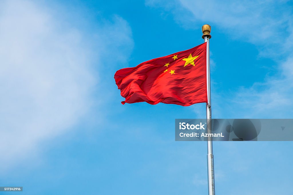 Chinese flag Chinese flag waving. Blue sky and clouds in the back. China - East Asia Stock Photo