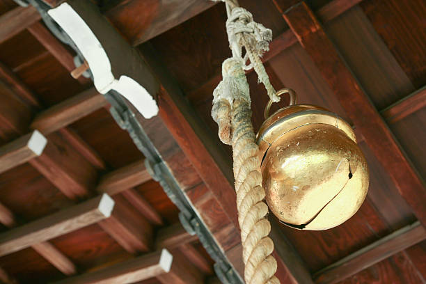 japanes bell hanging in a shinto temple a bell and rope hanging in an old japanese temple for peopole praying shrine stock pictures, royalty-free photos & images