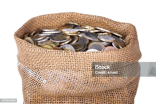 Money Bag With Coins Isolated At A White Background Stock Photo - Download Image Now
