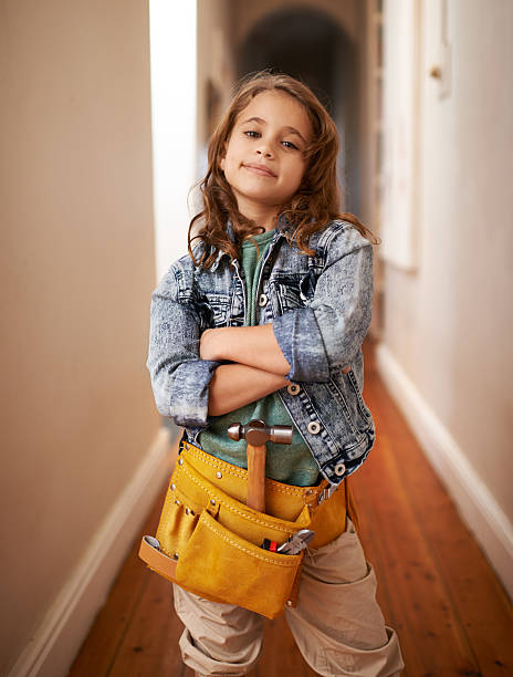 Leave the handy work to her Shot of an adorable little girl wearing a tool belt young cool girl stock pictures, royalty-free photos & images