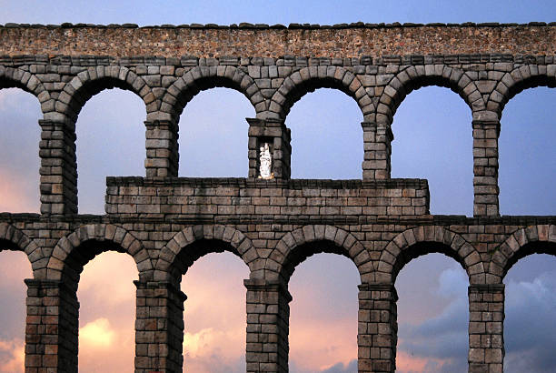 Roman aquaduct in Segovia, Spain, during sunset