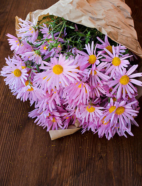 istock Chrysanthemum on wooden background 517344650