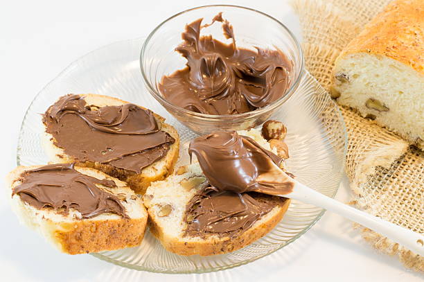 istock Chocolate cream on a homemade walnut bread 517346080