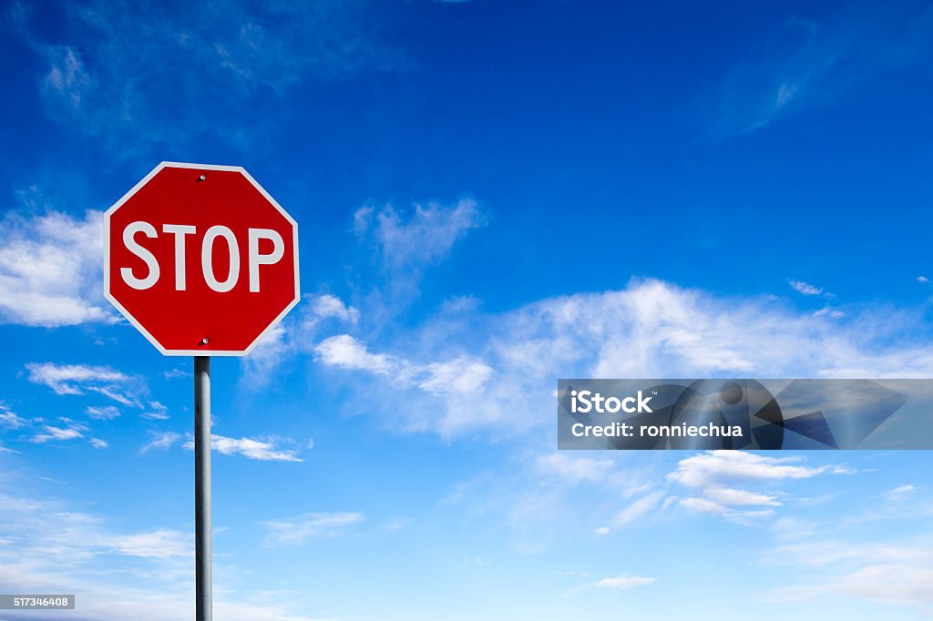 Stop Sign With Blue Sky Background and Copy Space Conceptual stop sign with blue sky background and copy space. Stop Sign Stock Photo