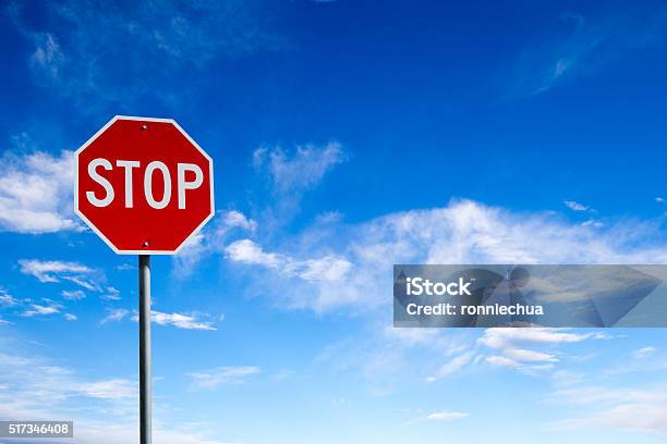 Stop Sign With Blue Sky Background And Copy Space Stock Photo - Download Image Now - Stop Sign, Stop - Single Word, Road Sign
