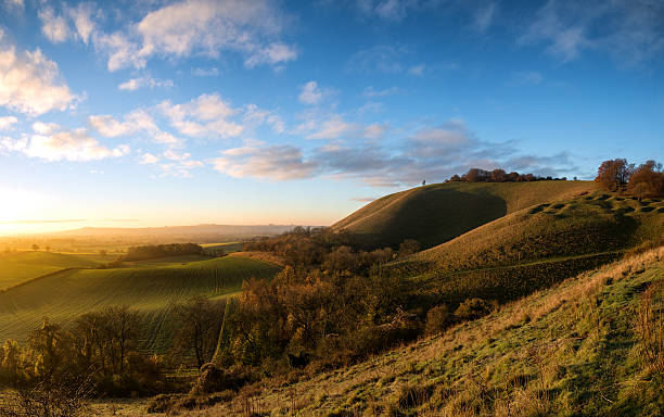 Stunning Autumn sunrise over countryside landscape Beautiful sunrise over rolling countryside landscape in Autumn wiltshire stock pictures, royalty-free photos & images