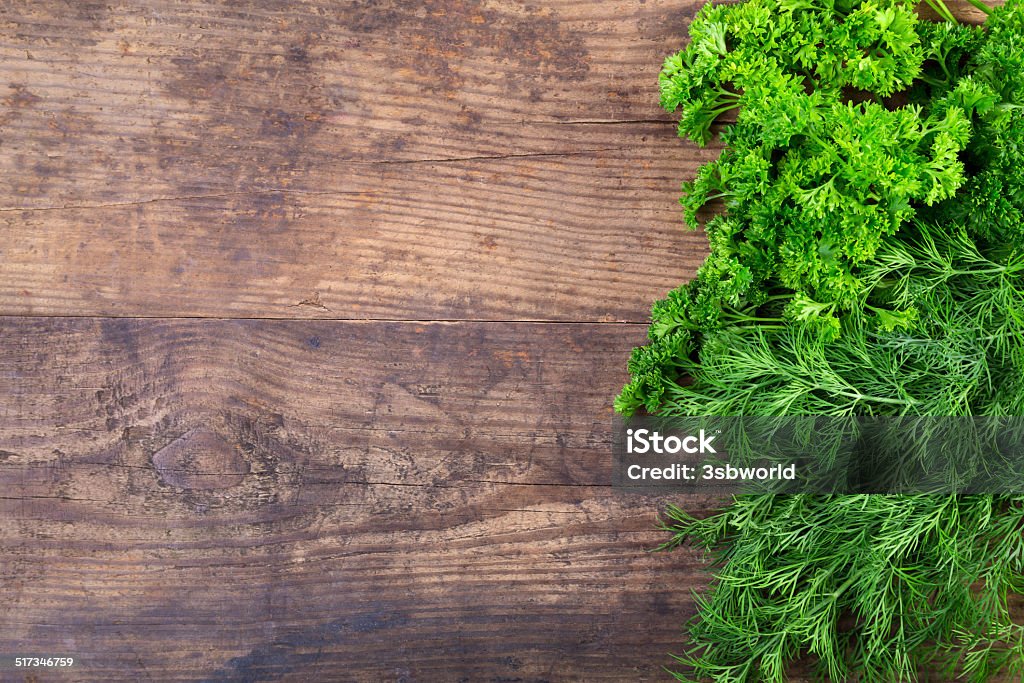 Parsley and dill on wooden table Greens parsley and dill on wooden background Abundance Stock Photo