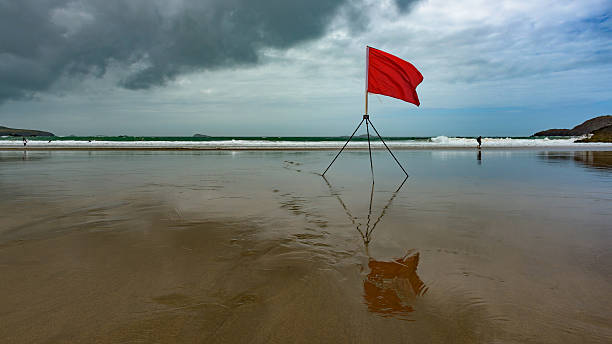 European beach with a red flag warning stock photo