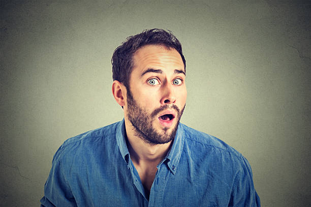 istock shocked young man in full disbelief 517346878