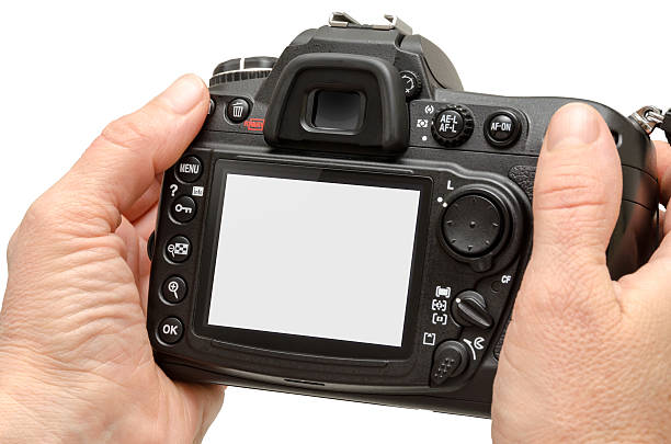 istock Isolated camera in hands. Isolated white screen for mockup. 517348500