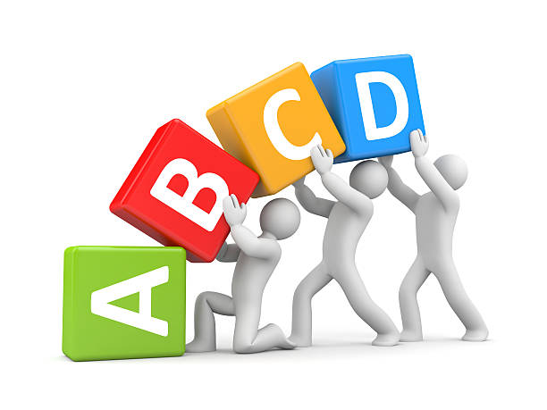istock Group of people holding toy blocks with alphabet 517349650