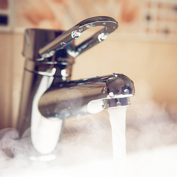 istock water tap with hot water steam 517350276