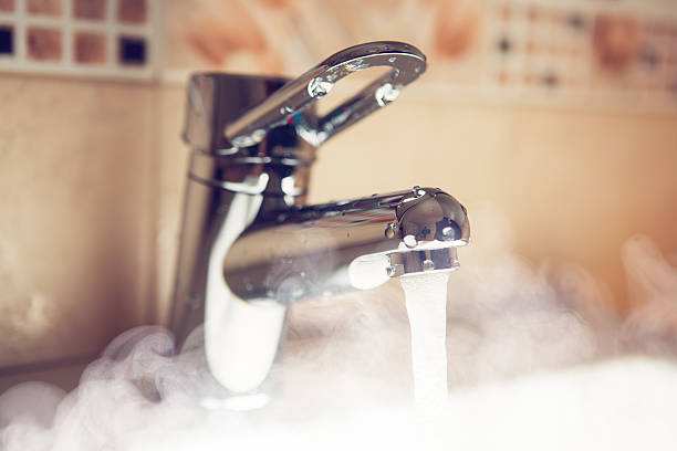 istock water tap with hot water steam 517350284