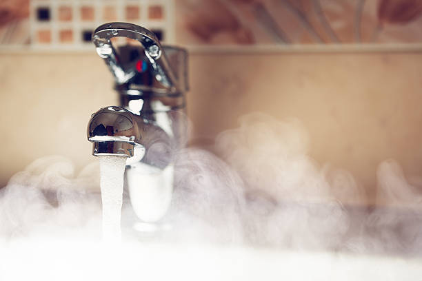 istock water tap with hot water steam 517350296