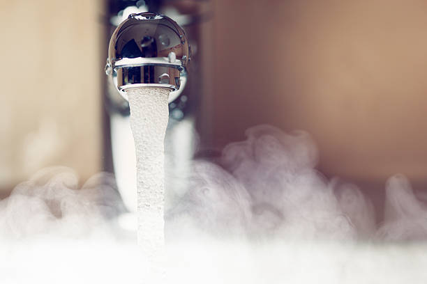 water tap with hot water steam water tap with hot water steam, closeup view steam stock pictures, royalty-free photos & images
