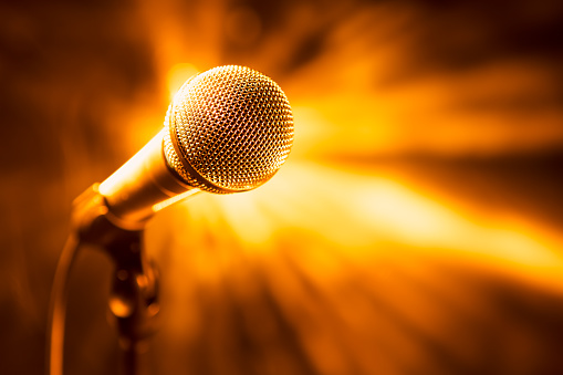 golden microphone on stage, closeup view