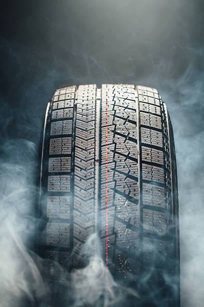 istock winter tire in smoke 517350382