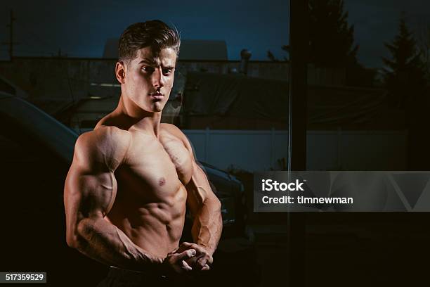 Attractive Young Strong Male Body Builder Flexing Stock Photo - Download Image Now - Abdomen, Adult, Adults Only