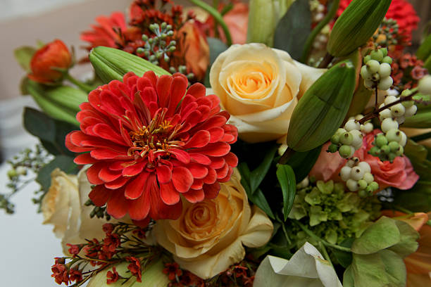 istock Red Zinnia and Roses Arrangement 517360689