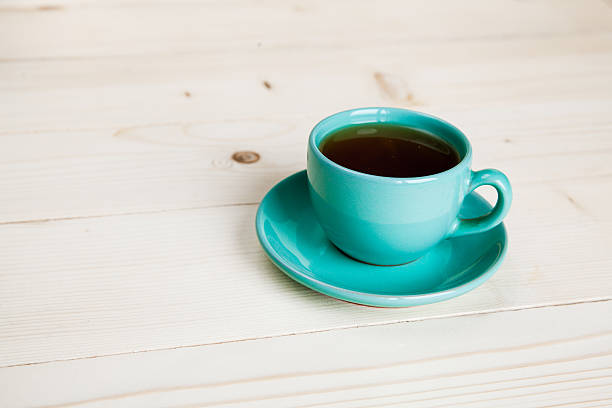 istock Cup of tea on wood background 517360729